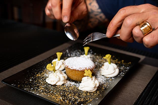 Guest enjoying an Italian dessert at the restaurant table